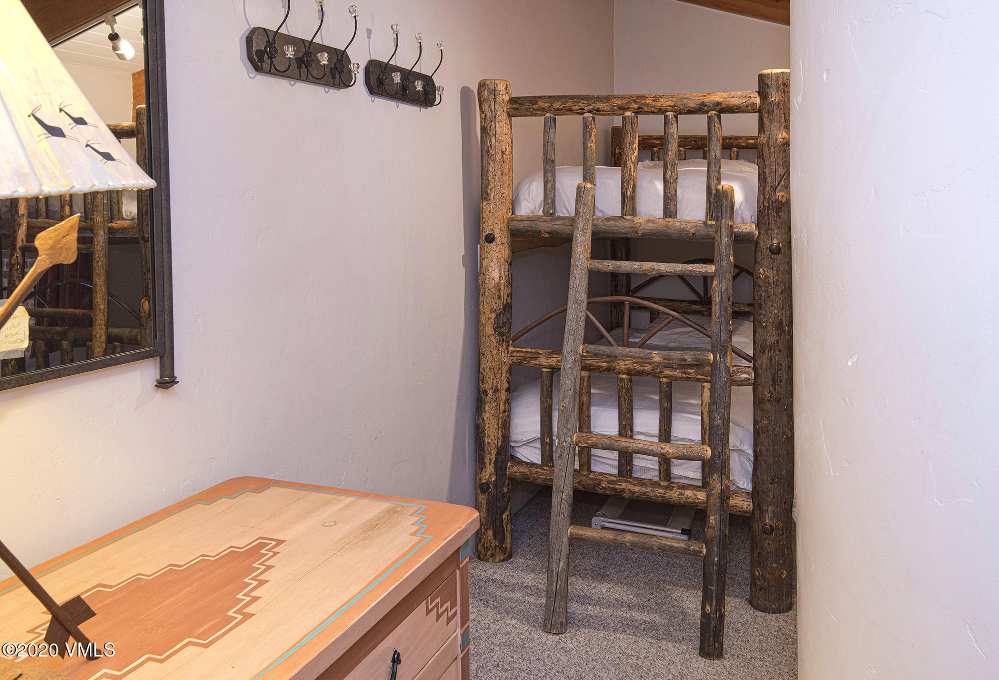 225 Wall Street, Unit 307 Vail, CO 81657 - Photo 18 of 31 a bedroom with a bed and furniture