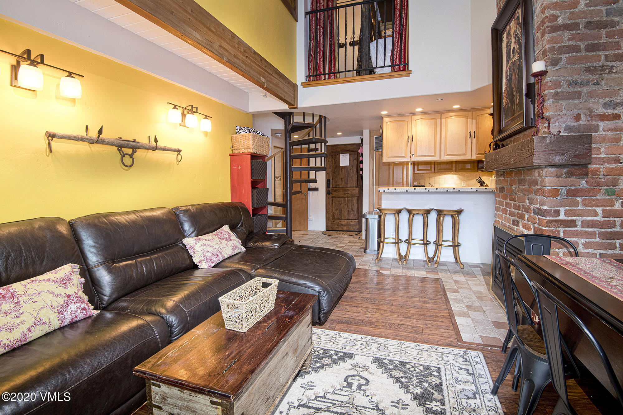 225 Wall Street, Unit 307 Vail, CO 81657 - Photo 2 of 31 a living room with furniture a rug and a table