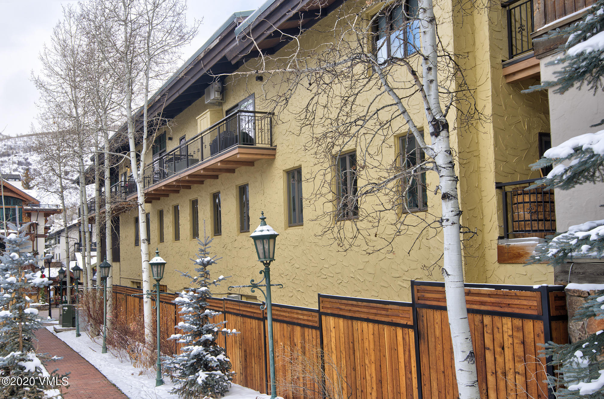 225 Wall Street, Unit 307 Vail, CO 81657 - Photo 28 of 31 a view of a brick house with many windows