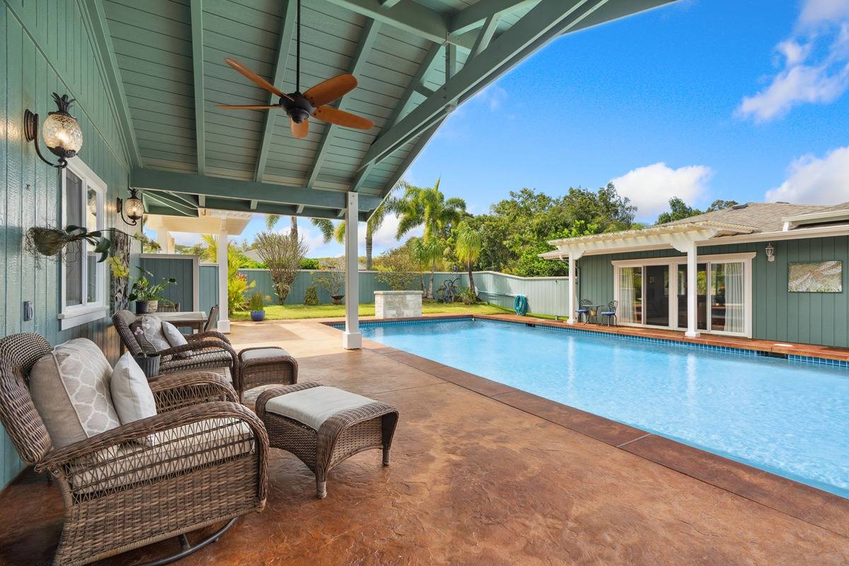 1661 Huli Road Kilauea, HI 96754 - Photo 1 of 28 a balcony with furniture