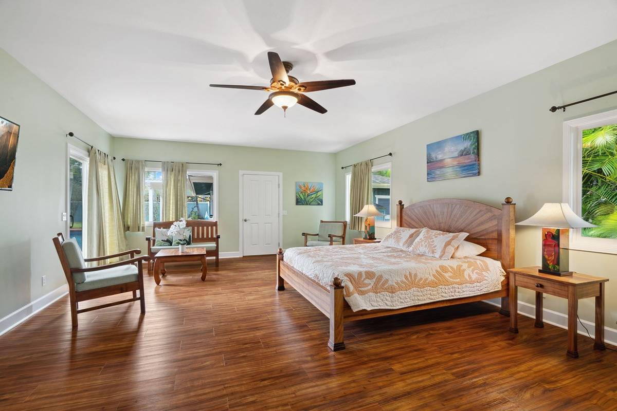 1661 Huli Road Kilauea, HI 96754 - Photo 12 of 28 a bedroom with a bed and a table