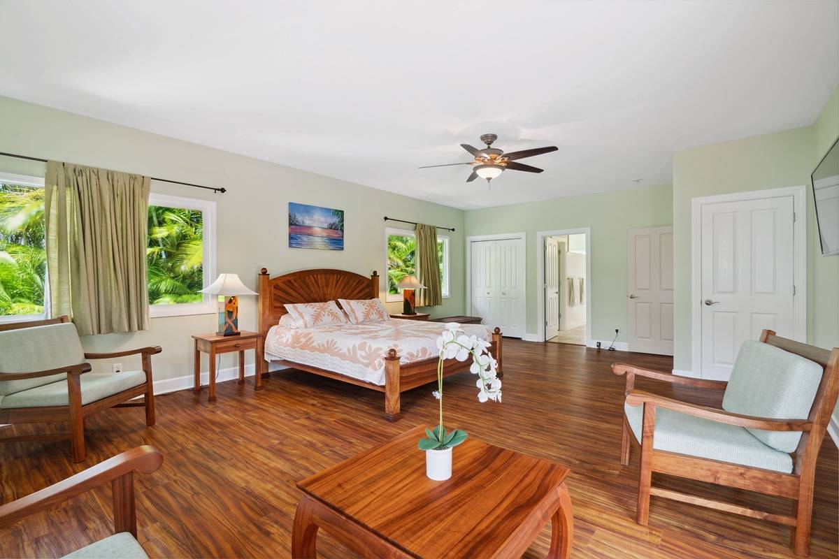 1661 Huli Road Kilauea, HI 96754 - Photo 13 of 28 a living room with furniture and wooden floor