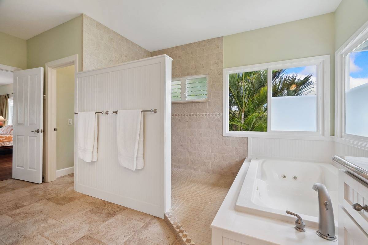 1661 Huli Road Kilauea, HI 96754 - Photo 14 of 28 a bathroom with a tub a window and a shower