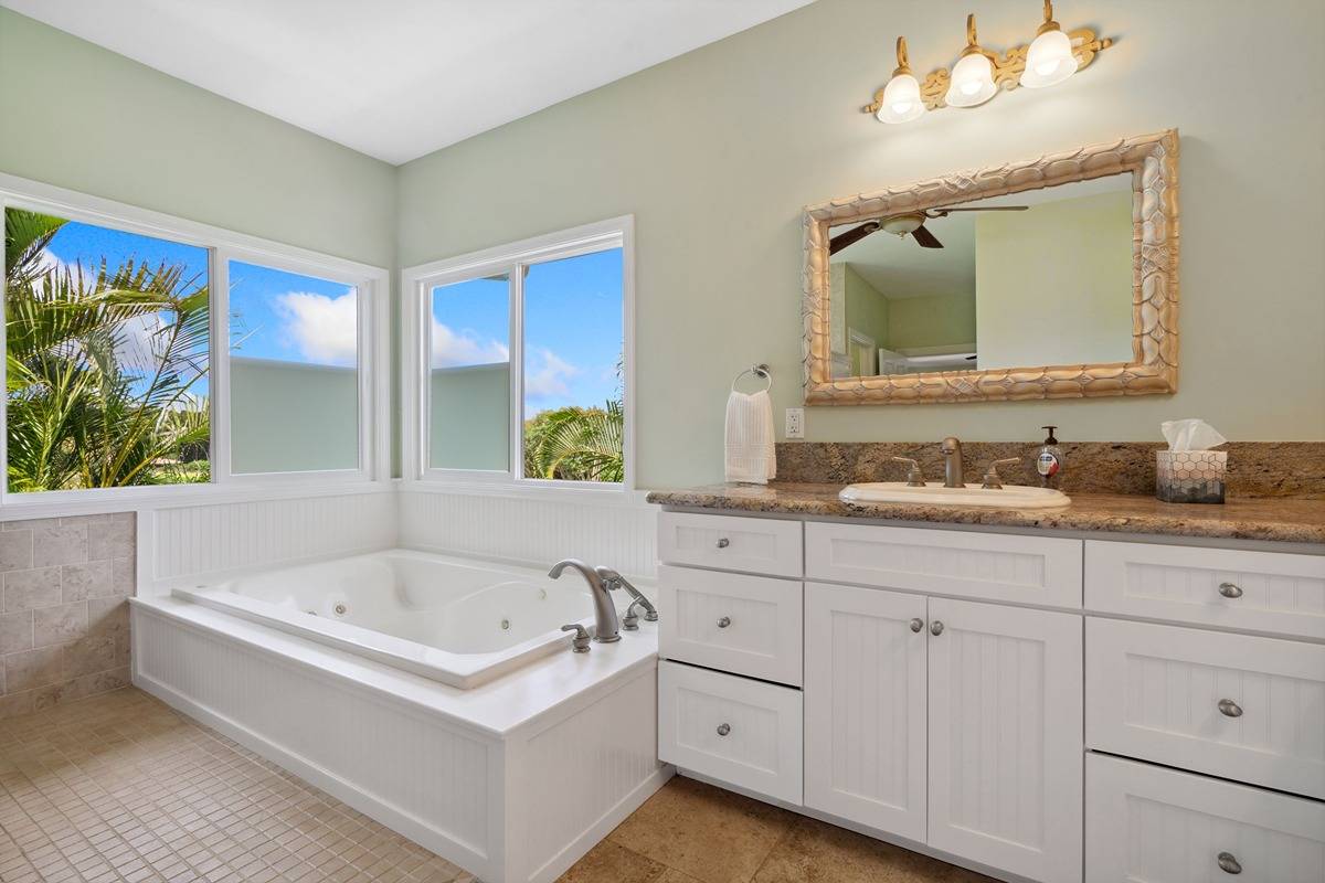 1661 Huli Road Kilauea, HI 96754 - Photo 15 of 28 a bathroom with a bathtub a double vanity sink and mirror