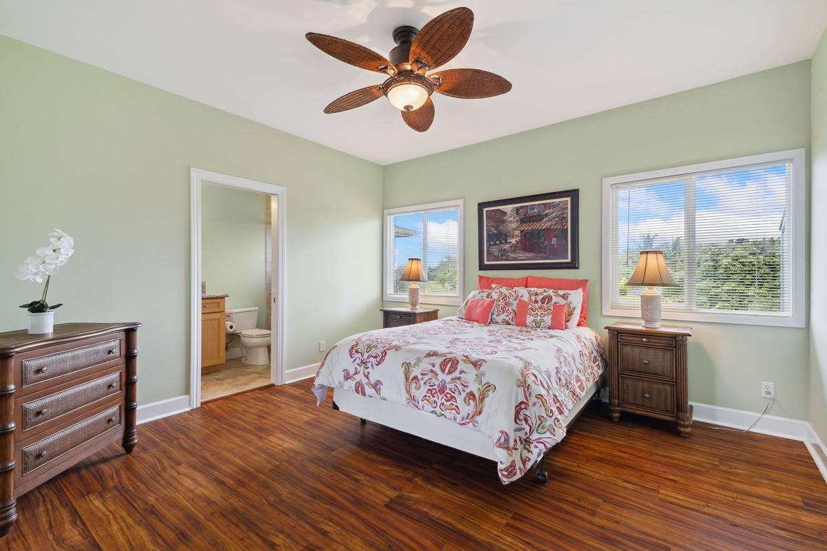 1661 Huli Road Kilauea, HI 96754 - Photo 22 of 28 a bedroom with a bed and a dresser