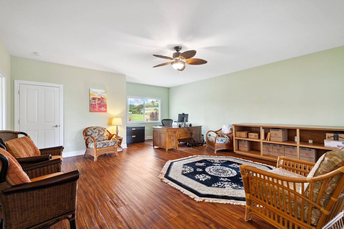 1661 Huli Road Kilauea, HI 96754 - Photo 24 of 28 a living room with furniture and a window