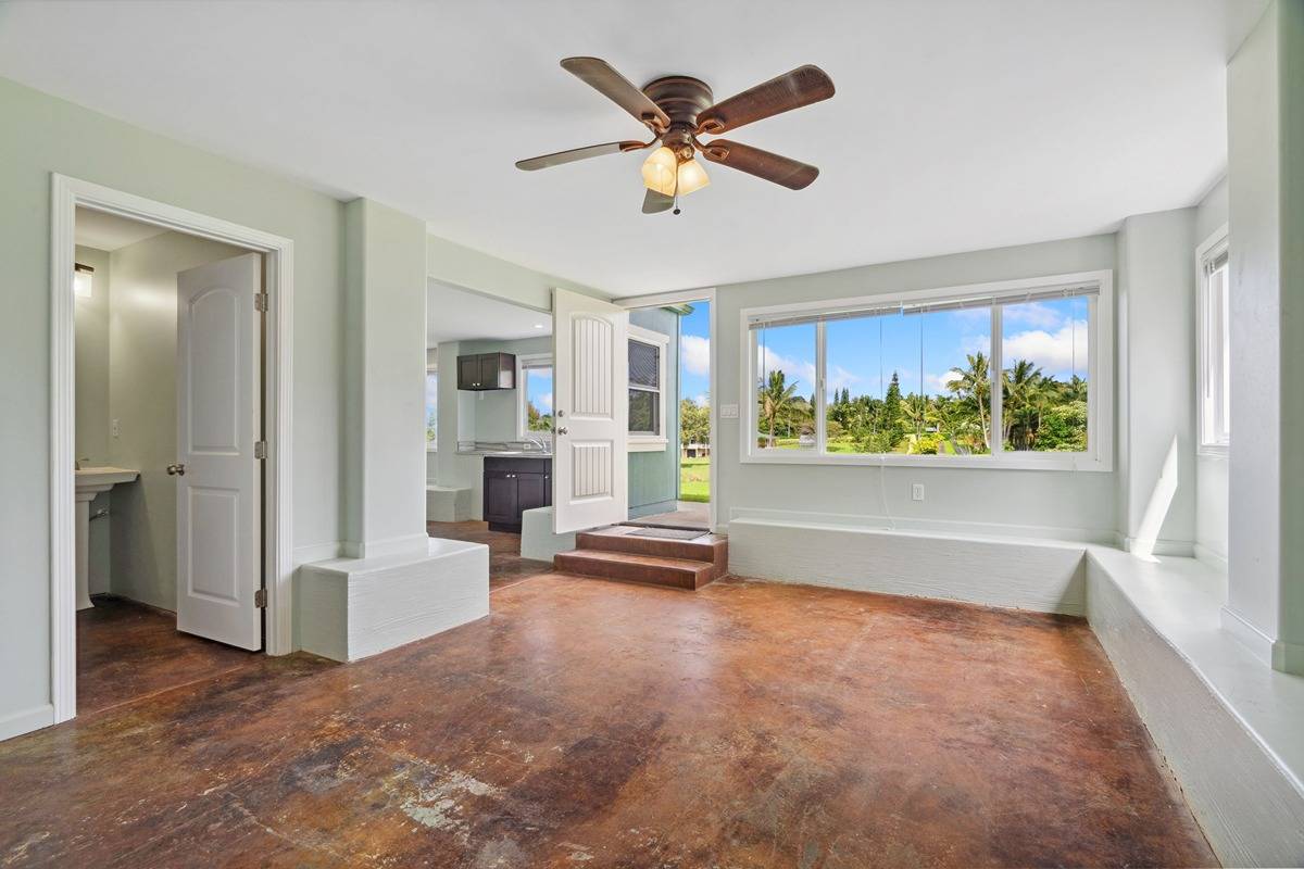 1661 Huli Road Kilauea, HI 96754 - Photo 26 of 28 wooden floor in an empty room with a window