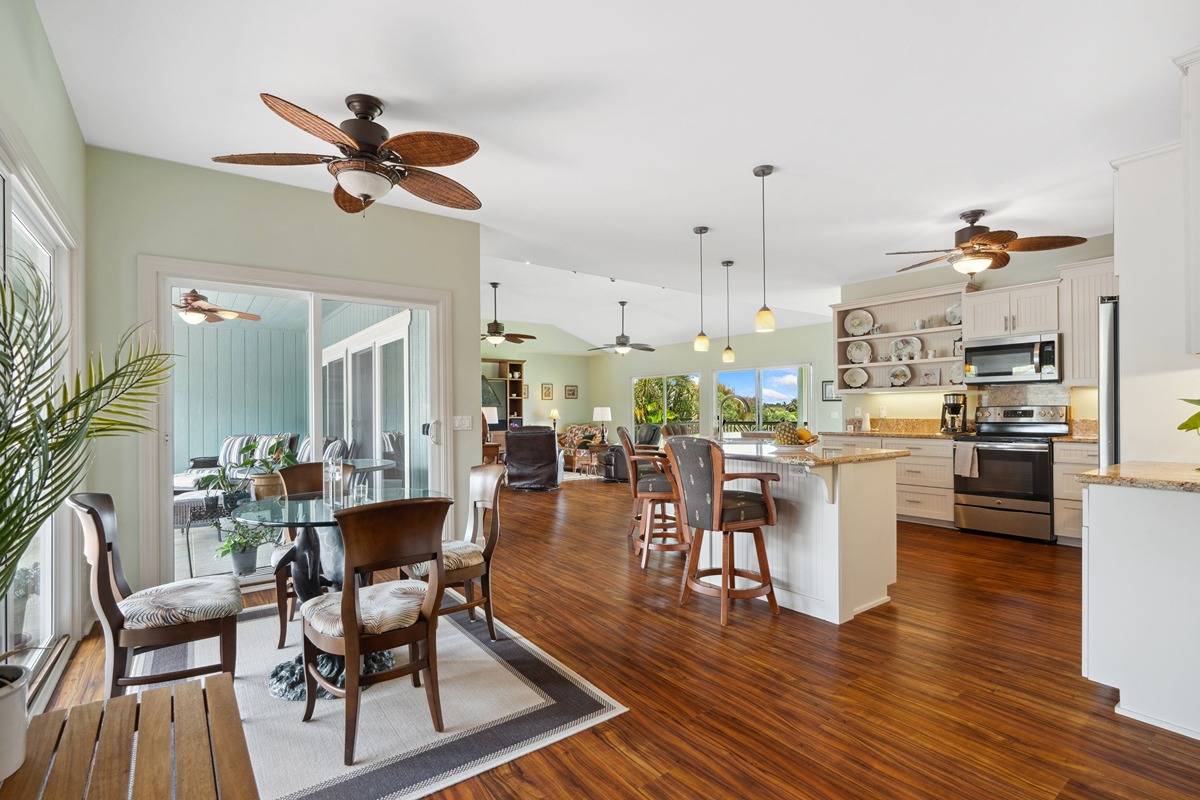 1661 Huli Road Kilauea, HI 96754 - Photo 7 of 28 a living room with lots of furniture and kitchen view