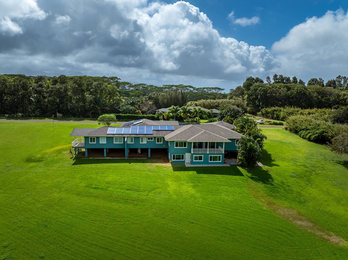 1661 Huli Road Kilauea, HI 96754 - Photo 8 of 28 a view of a garden with a house in the background