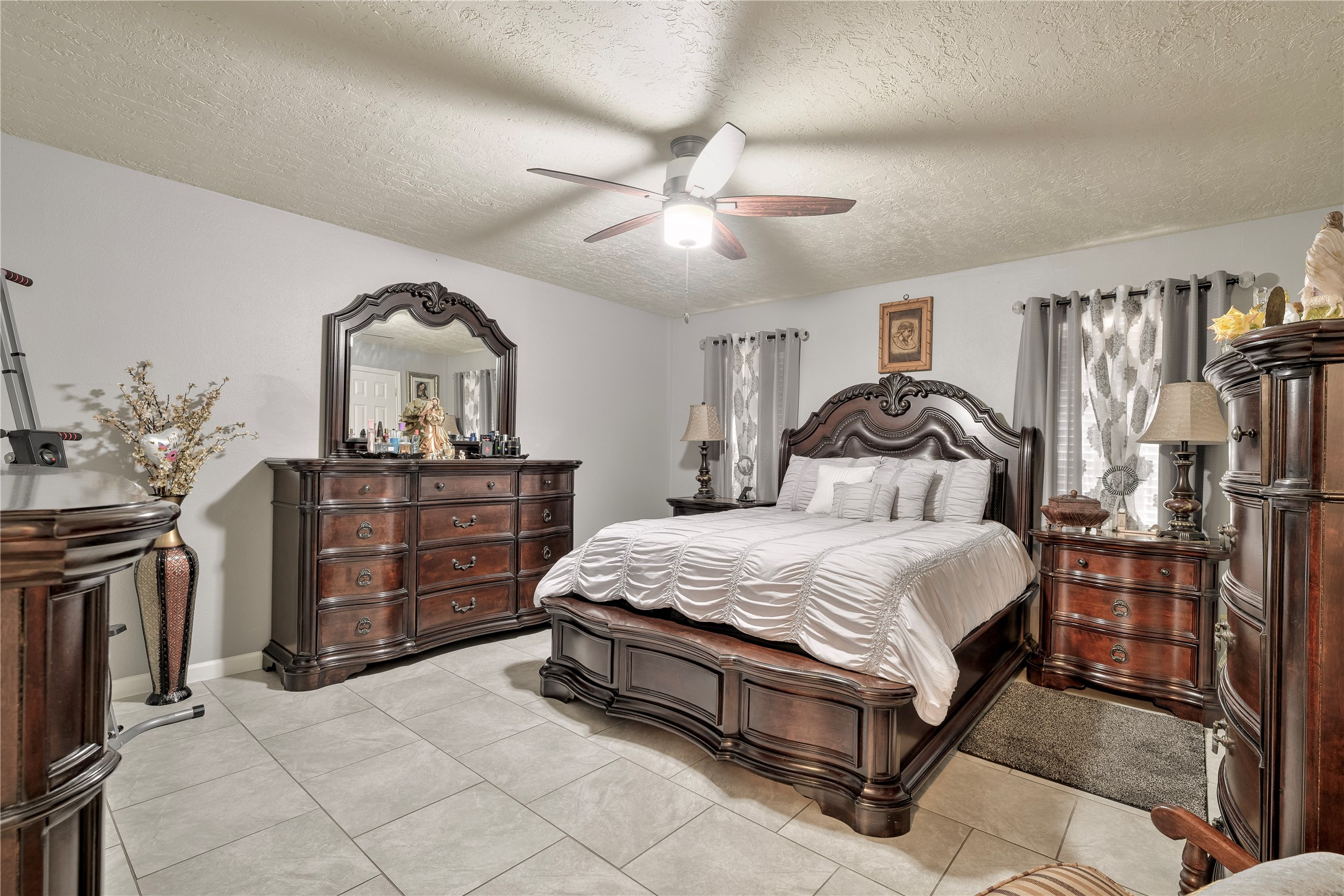 4110 Anice Street Houston, TX 77039 - Photo 15 of 29 a bedroom with a bed and a chandelier