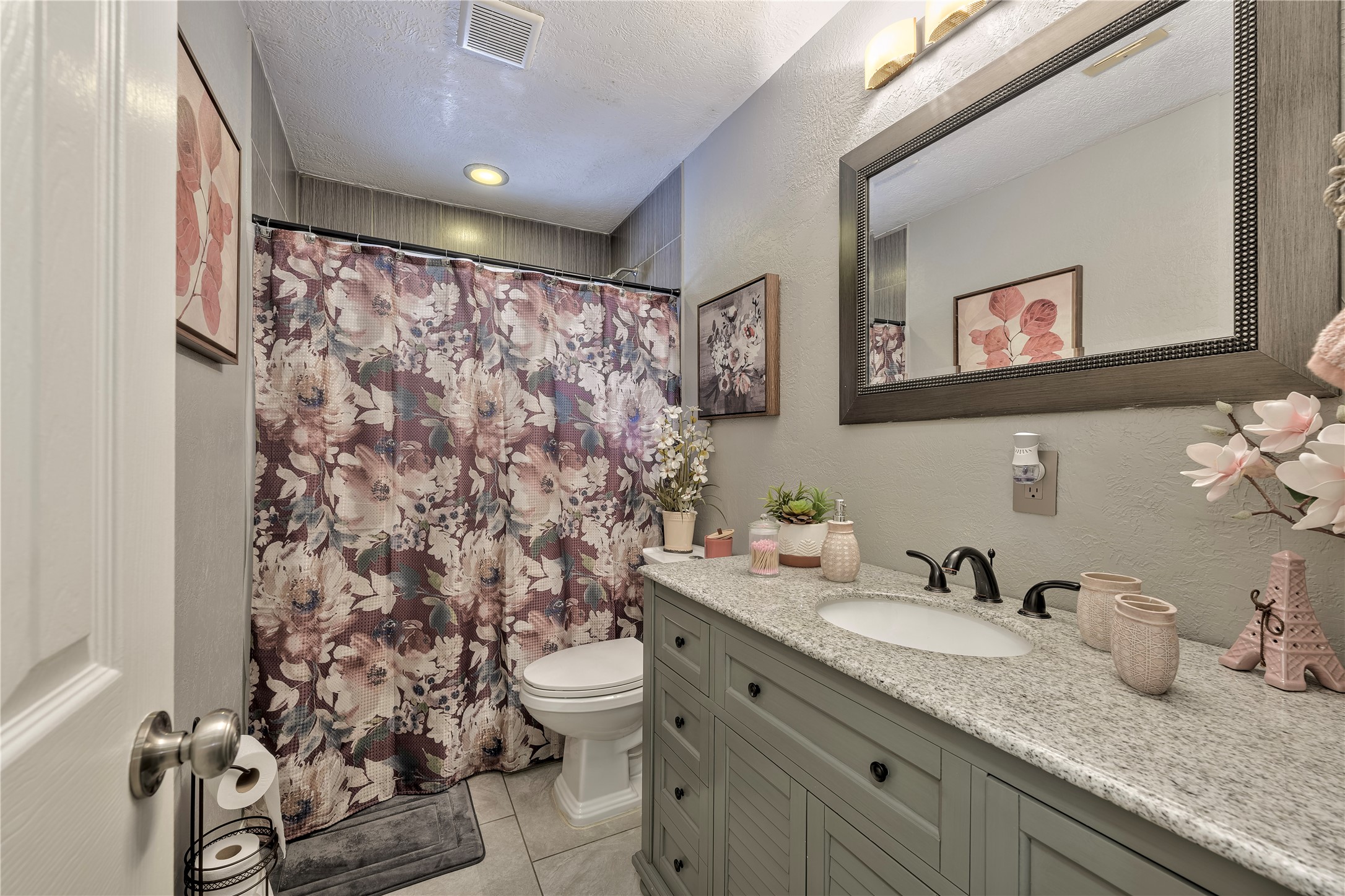 4110 Anice Street Houston, TX 77039 - Photo 19 of 29 a bathroom with a granite countertop sink mirror vanity and toilet