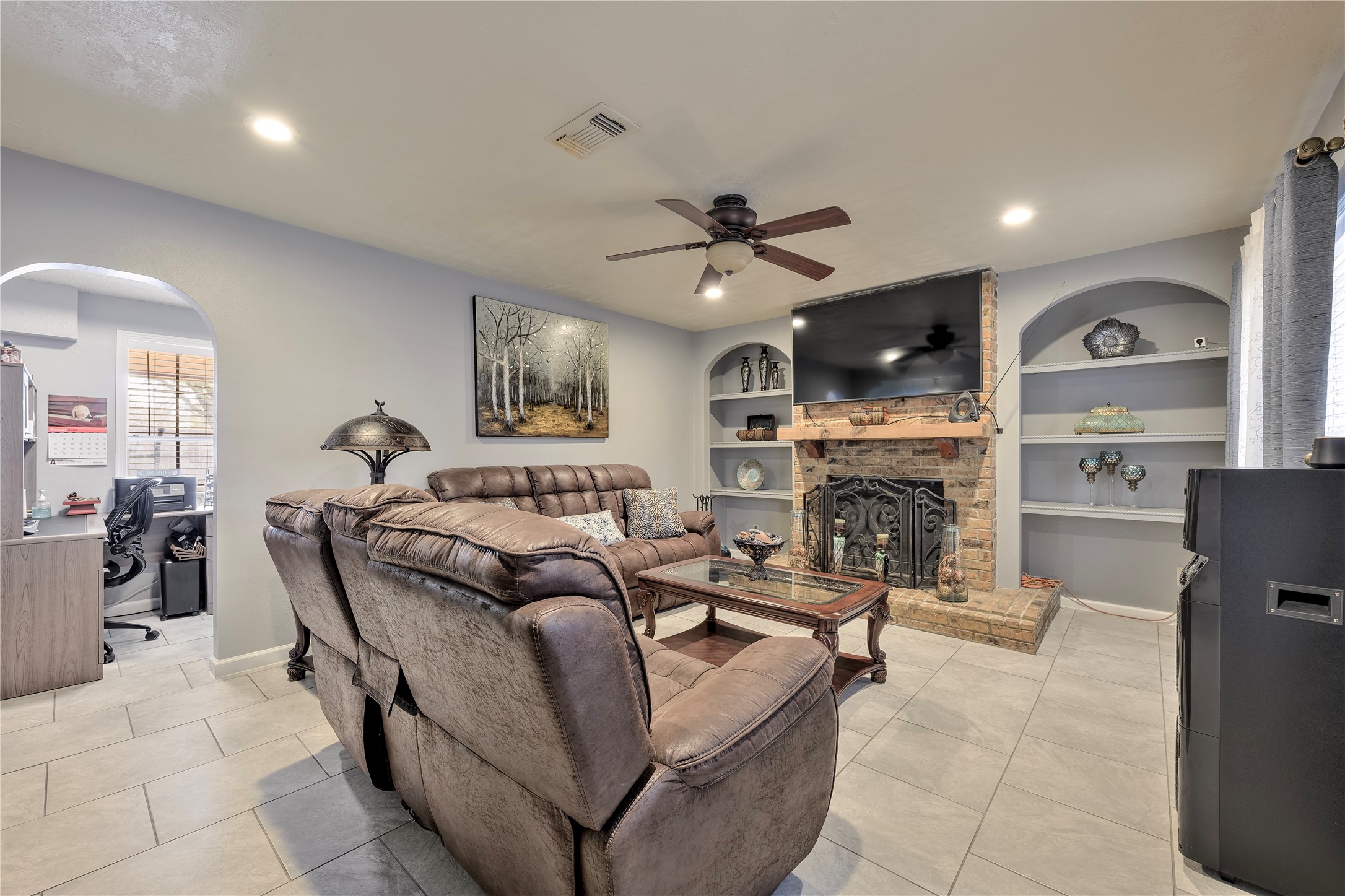 4110 Anice Street Houston, TX 77039 - Photo 9 of 29 a living room with furniture and a fireplace