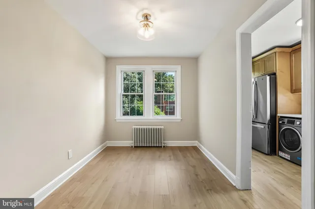 a kitchen with cabinets and a stove top oven