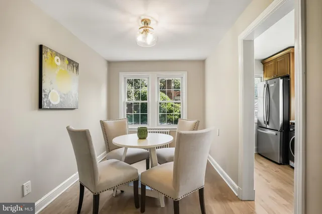 a dining room with furniture and window