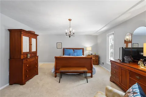 a bedroom with bed and window