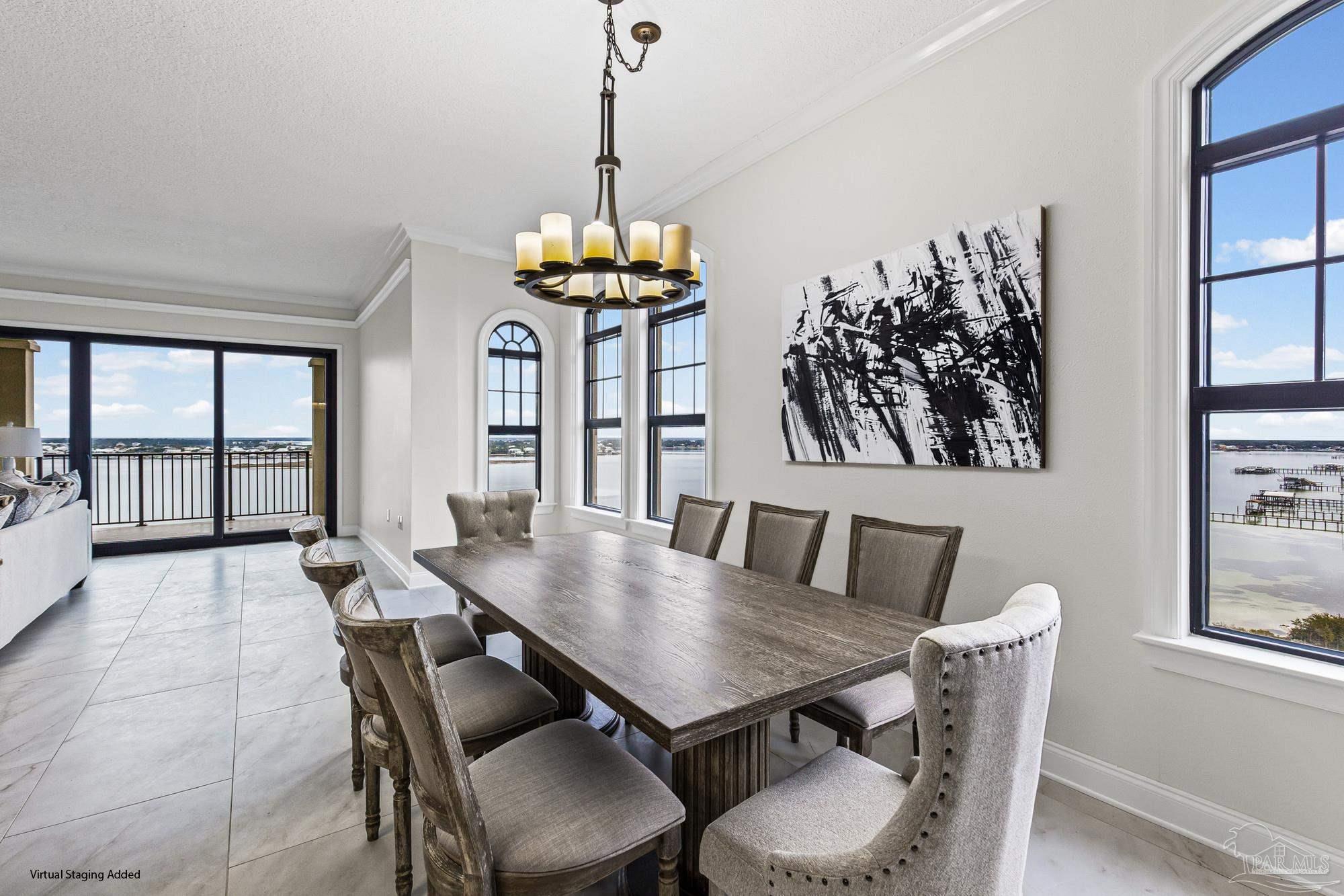 14900 River Road, Unit 904 Perdido Key, FL 32507 - Photo 10 of 62 a view of a dining room with furniture window and outside view