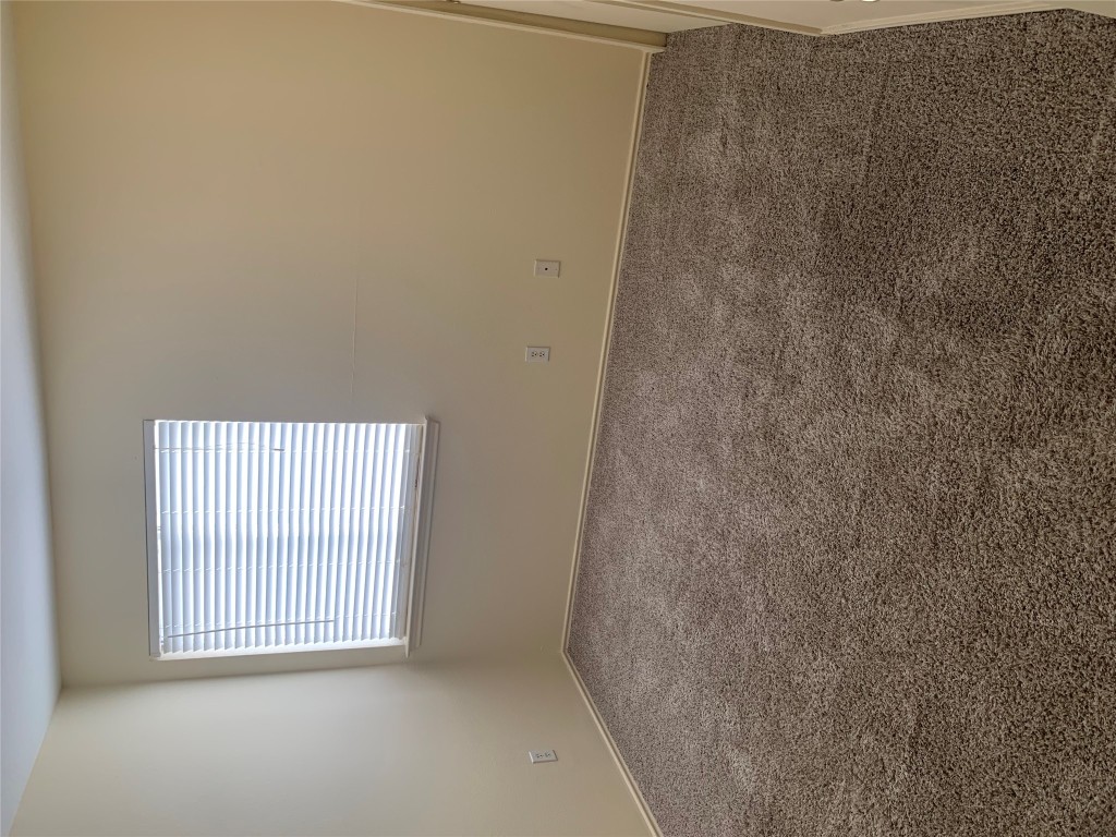 11904 Lima Drive Manor, TX 78653 - Photo 6 of 10 an empty room with a window