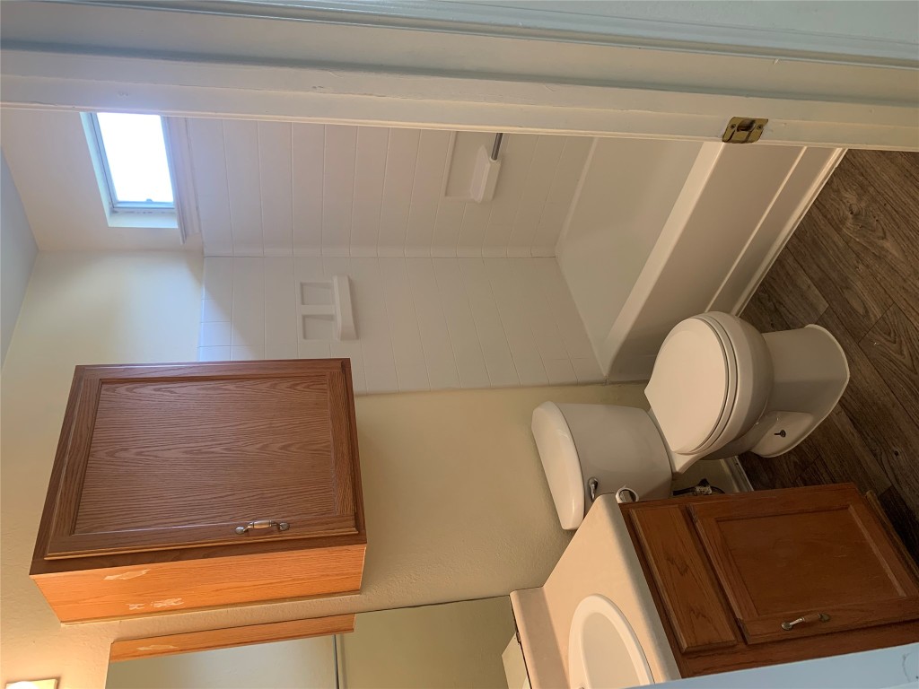 11904 Lima Drive Manor, TX 78653 - Photo 10 of 10 a bathroom with a toilet a sink and bathtub