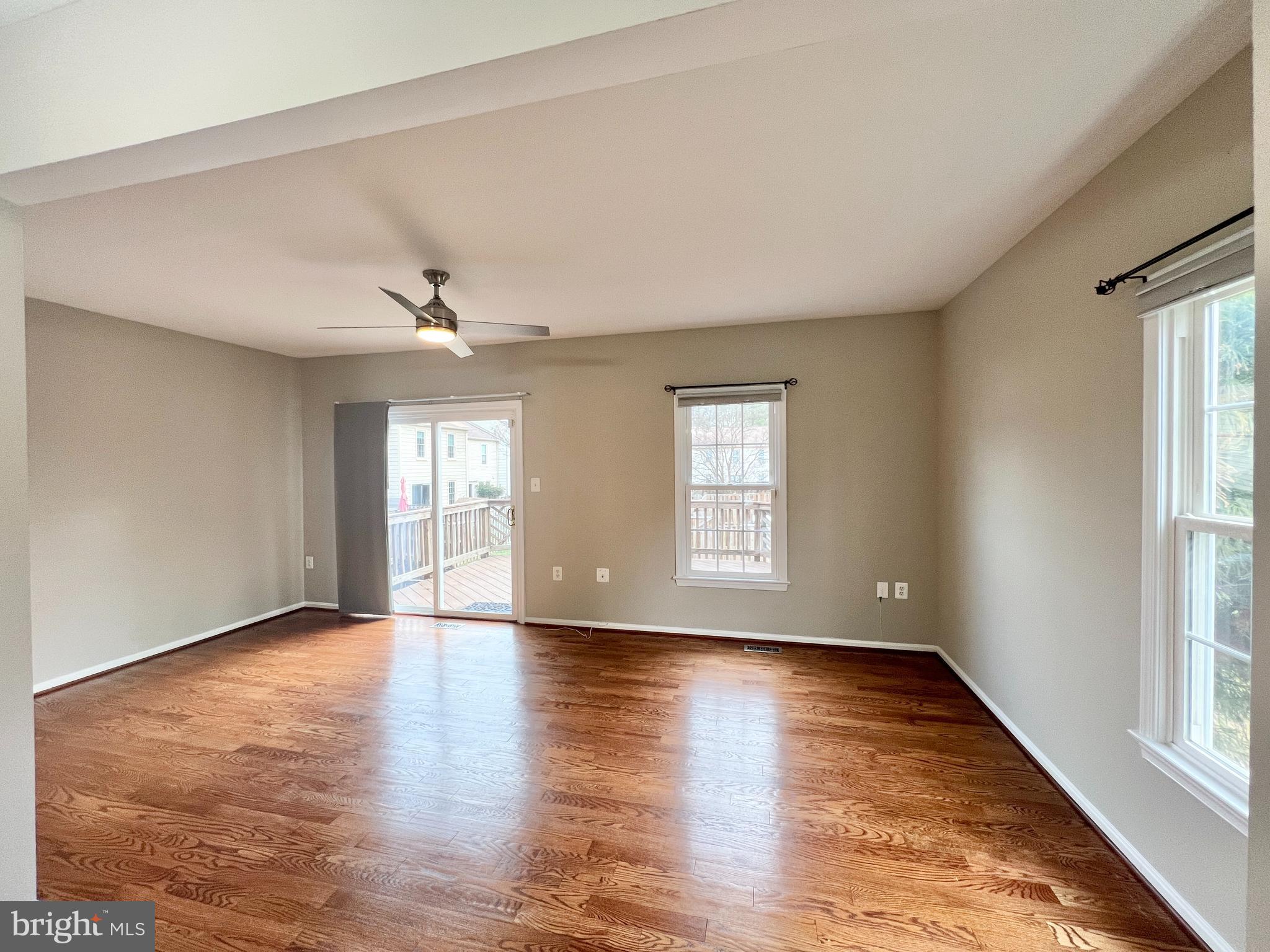 10287 Latney Road Fairfax, VA 22032 - Photo 8 of 26 a view of an empty room with wooden floor and a window