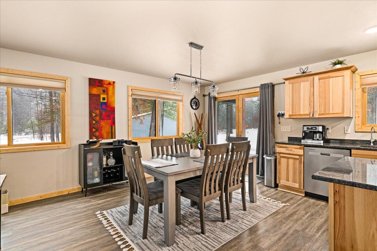 11411 West 3rd Street Solon Springs, WI 54873 - Photo 3 of 33 natural woodwork, 6-panel doors, Marvin windows, in-floor heat throughout, wood-look plank flooring, tasteful curtains and blinds, elegant lighting and MORE!