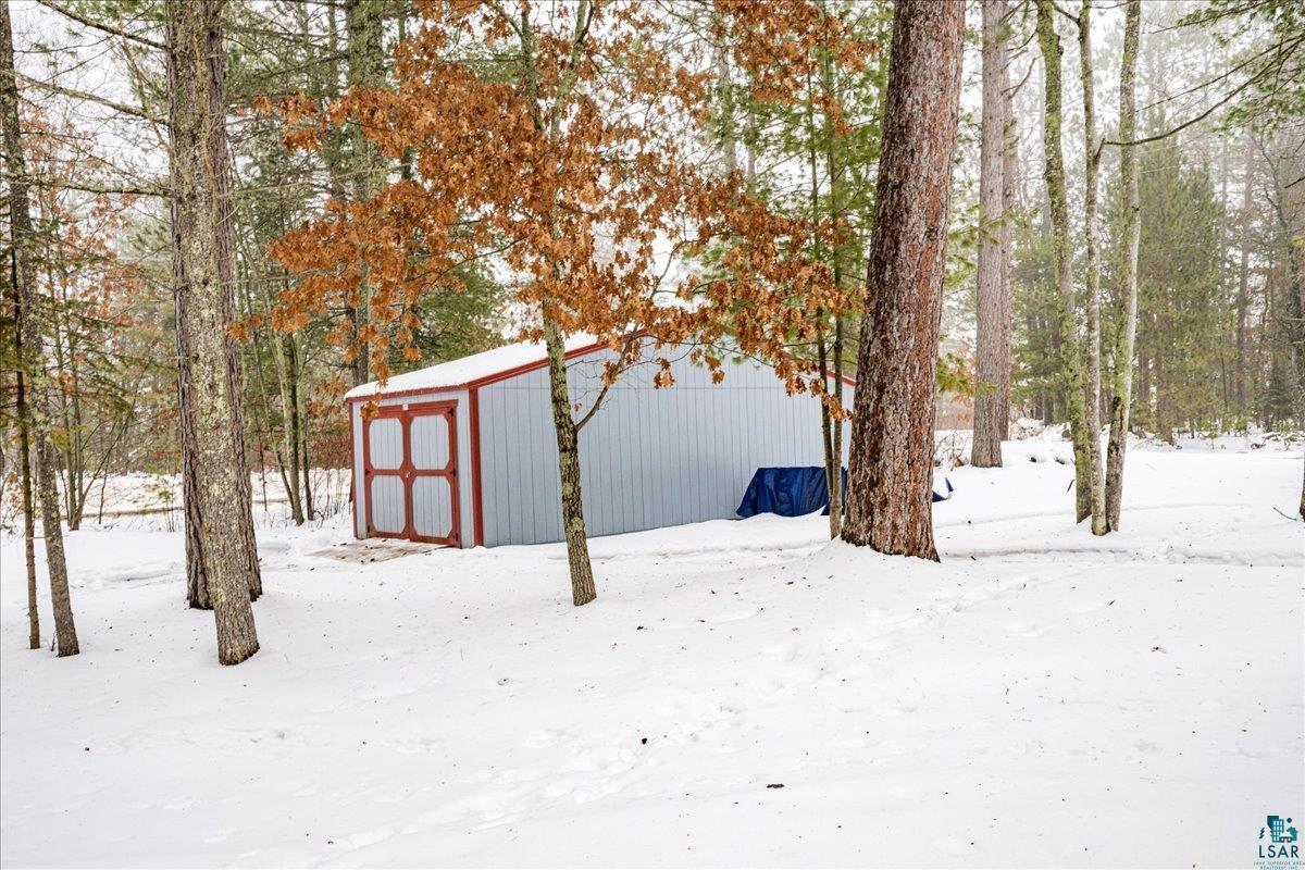 11411 South 3rd Street East Solon Springs, WI 54873 - Photo 33 of 40 Seller recently installed this huge 11' x 28' Shed. This offers you GREAT additional storage options for all your tools, equipment and toys.