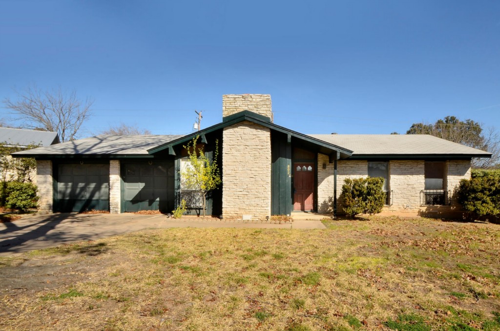 802 Riddlewood Drive Austin, TX 78753 - Photo 1 of 1 a view of a house with a yard covered in snow