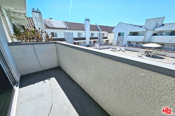 a view of a back yard from a corridor