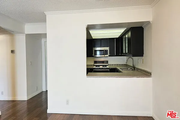 a view of a livingroom with wooden floor