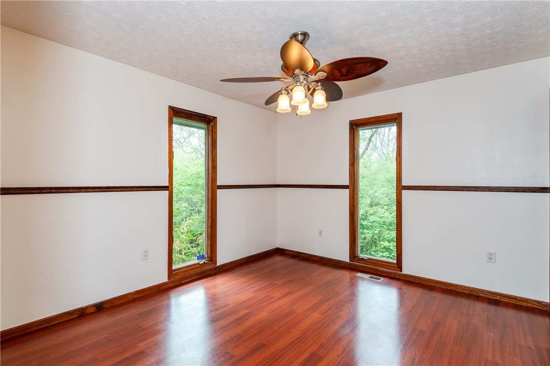 6750 Little Twin Road Germantown, OH 45327 - Photo 27 of 88 This bright room features beautiful hardwood floors and large windows framing lush outdoor views.