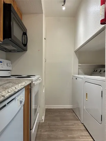 a kitchen with a stove and a microwave