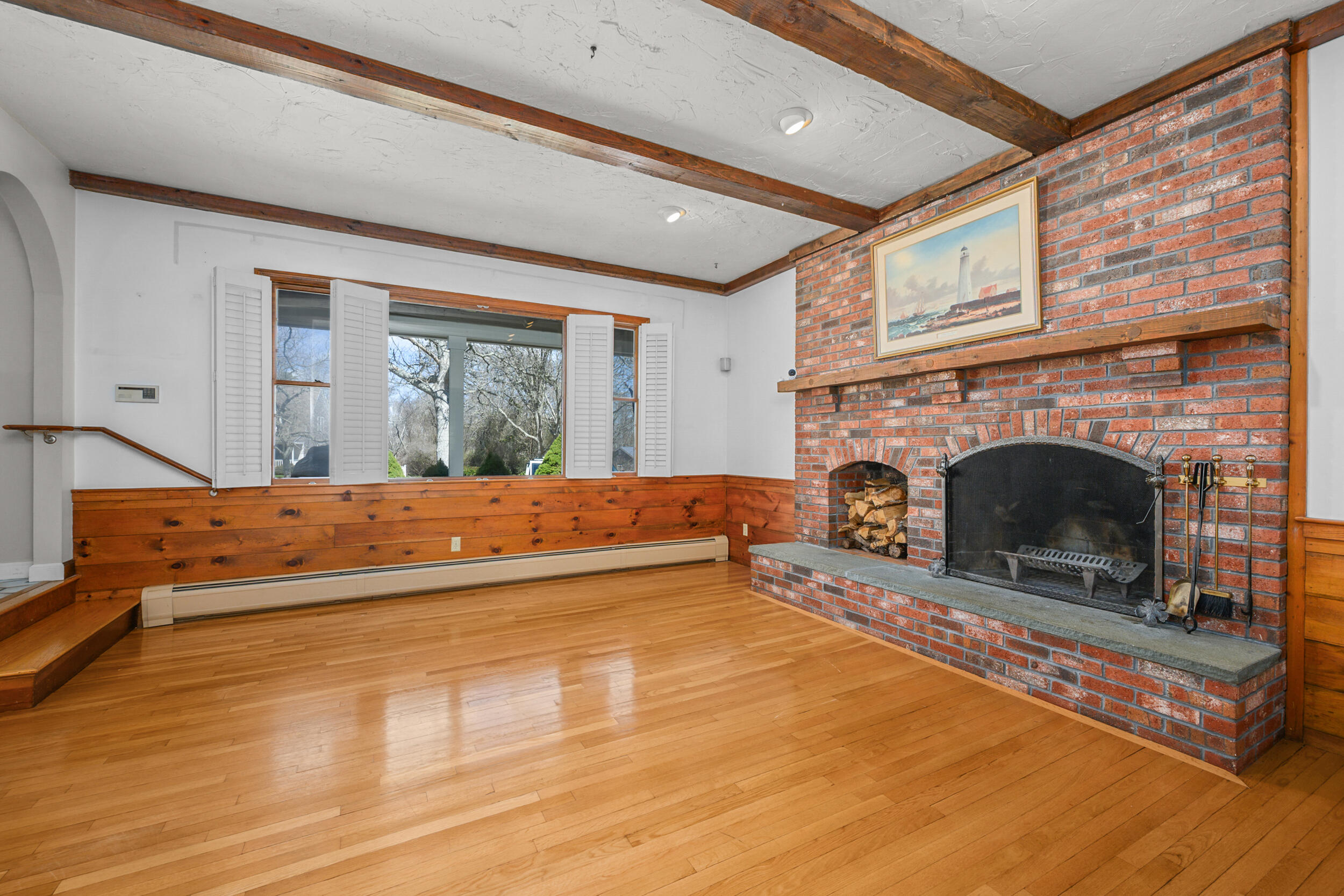 43 Sturgis Lane Barnstable, MA 02630 - Photo 14 of 70 a spacious bedroom with a bed and a fireplace