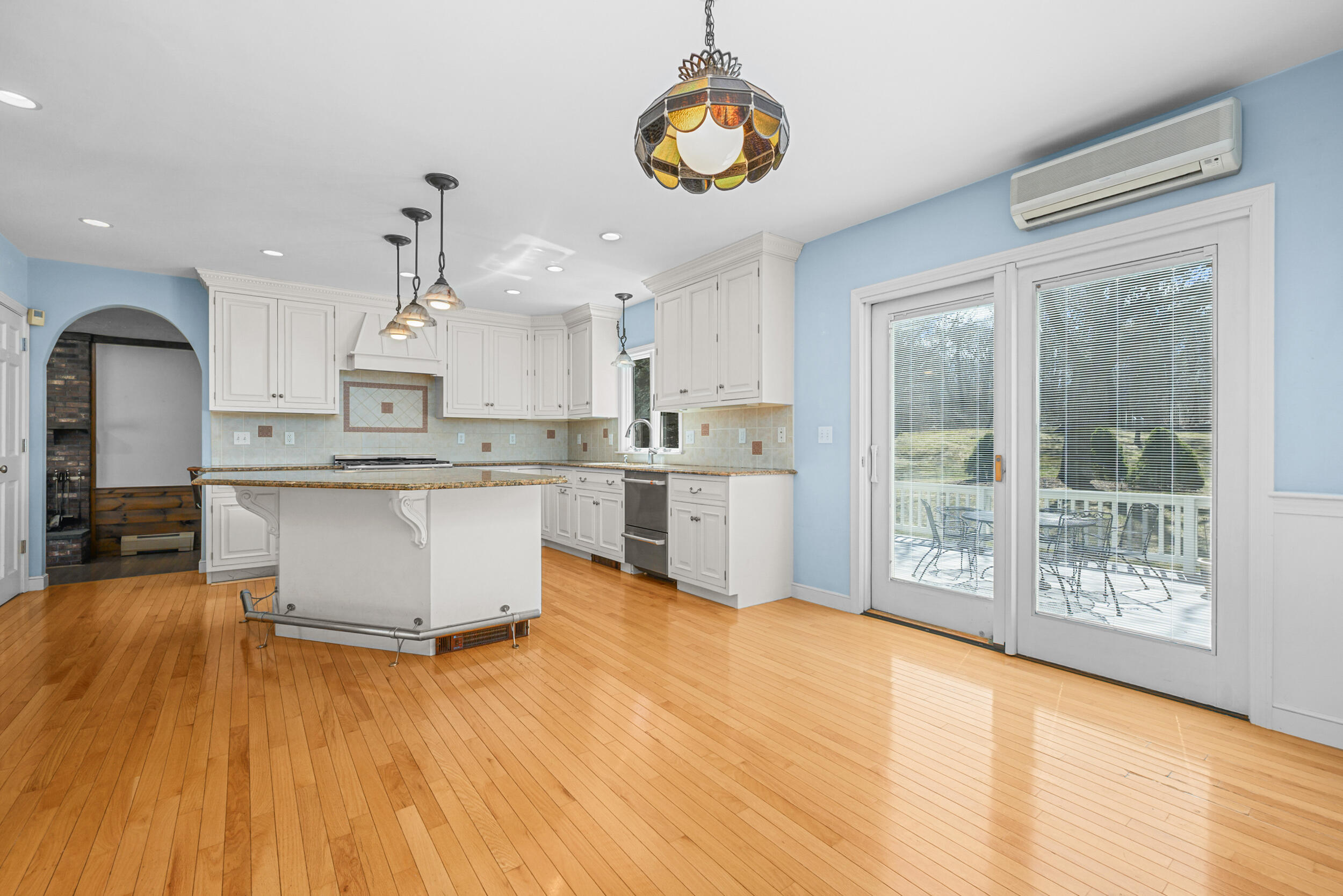 43 Sturgis Lane Barnstable, MA 02630 - Photo 16 of 70 a large kitchen with stainless steel appliances granite countertop a lot of counter space and wooden floors