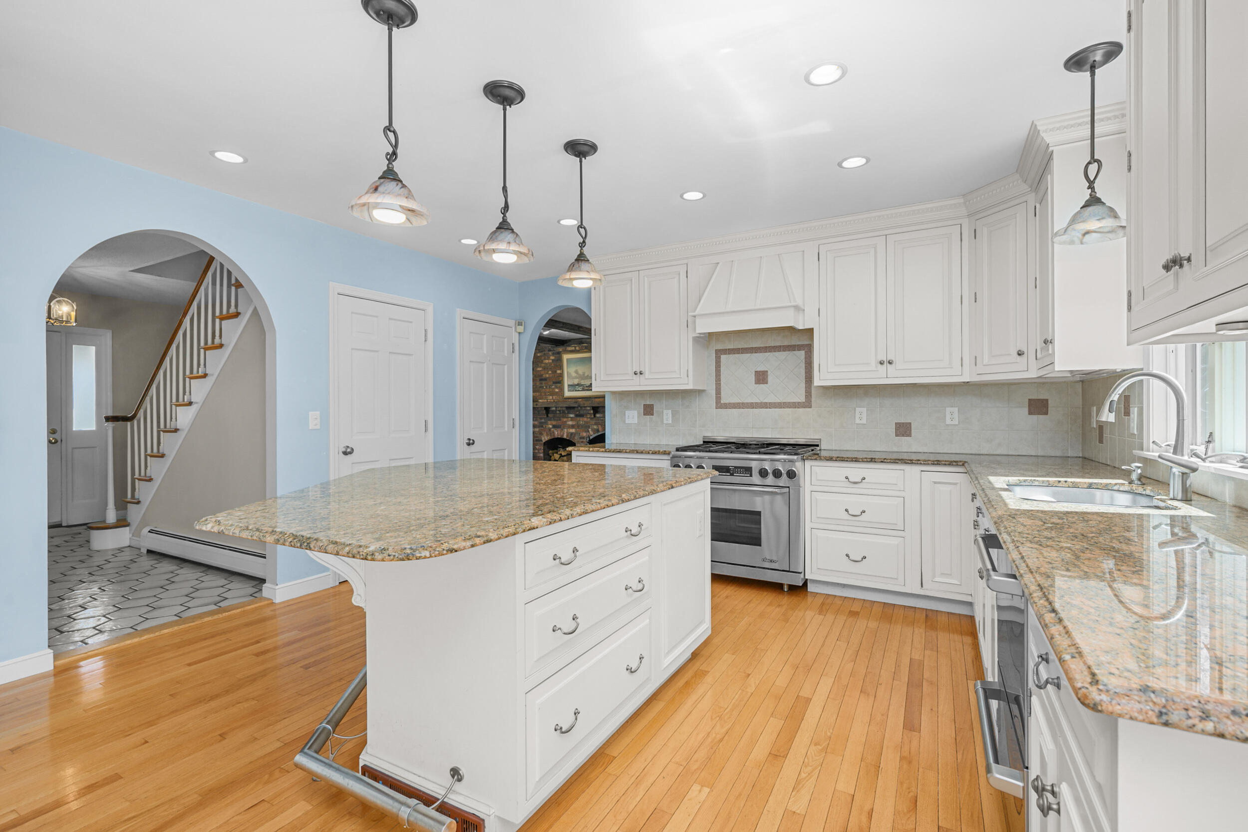43 Sturgis Lane Barnstable, MA 02630 - Photo 17 of 70 a large kitchen with granite countertop a stove a sink a center island and cabinets