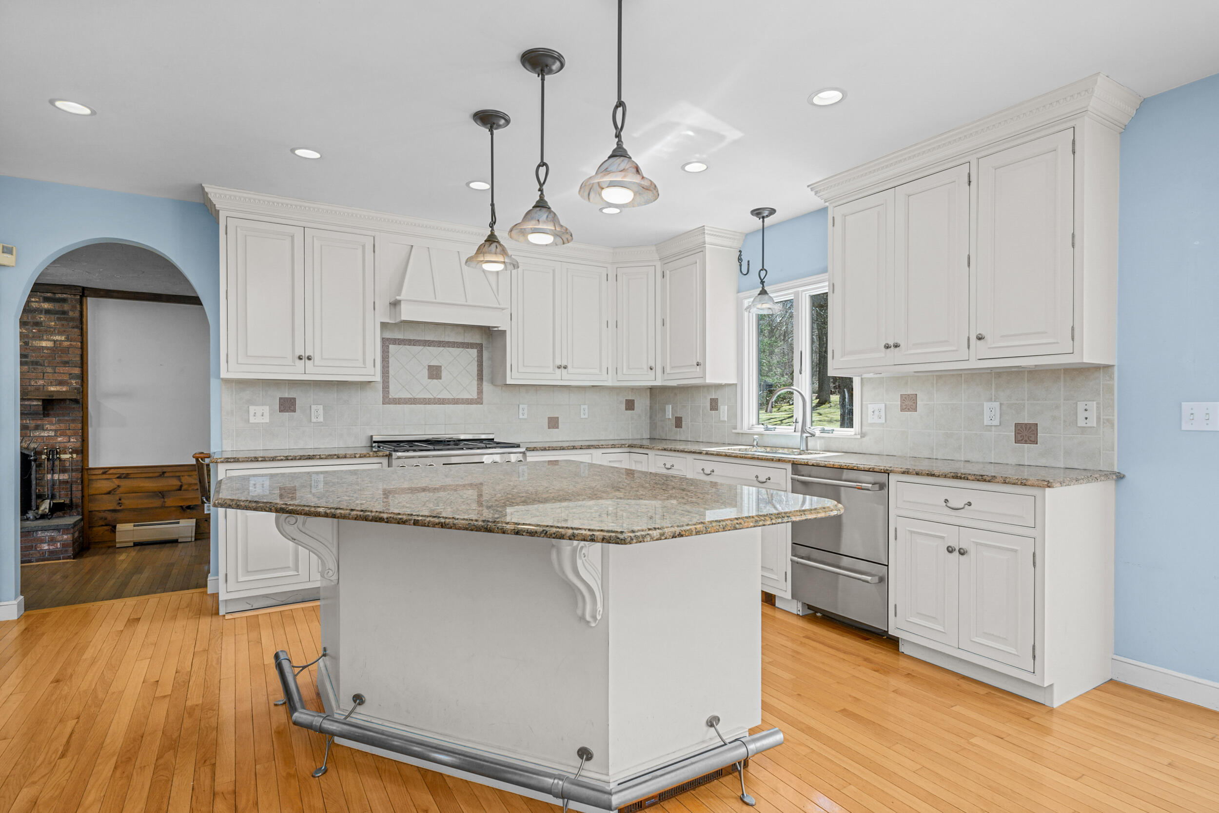43 Sturgis Lane Barnstable, MA 02630 - Photo 18 of 70 a kitchen with stainless steel appliances granite countertop a sink a stove a refrigerator and island with wooden floor