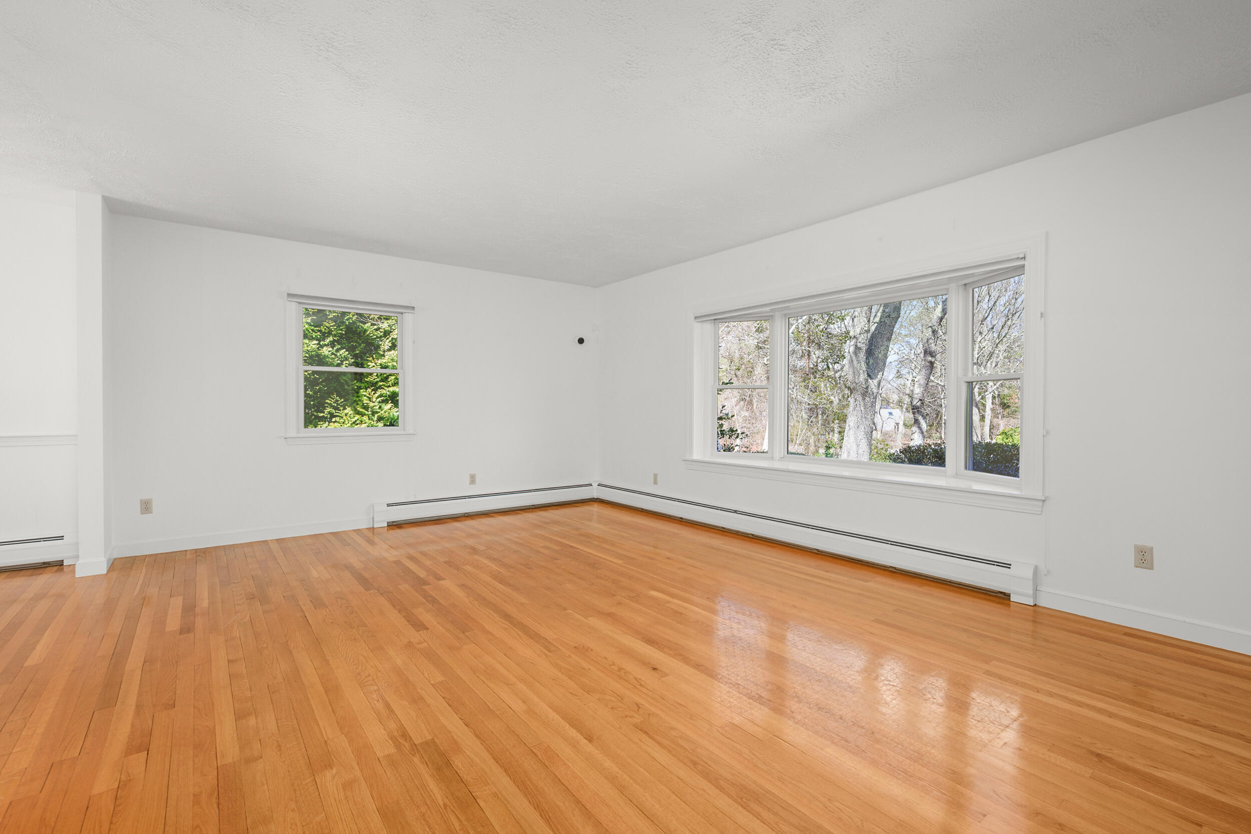 43 Sturgis Lane Barnstable, MA 02630 - Photo 21 of 70 a view of an empty room with a window and wooden floor