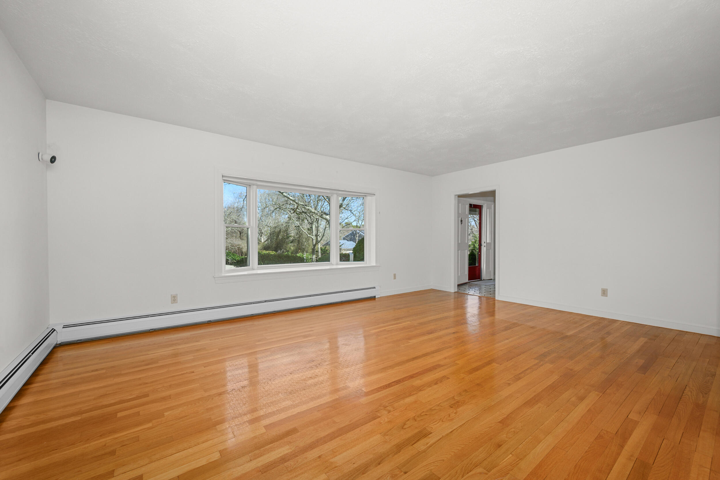 43 Sturgis Lane Barnstable, MA 02630 - Photo 22 of 70 a view of an empty room with wooden floor and a window