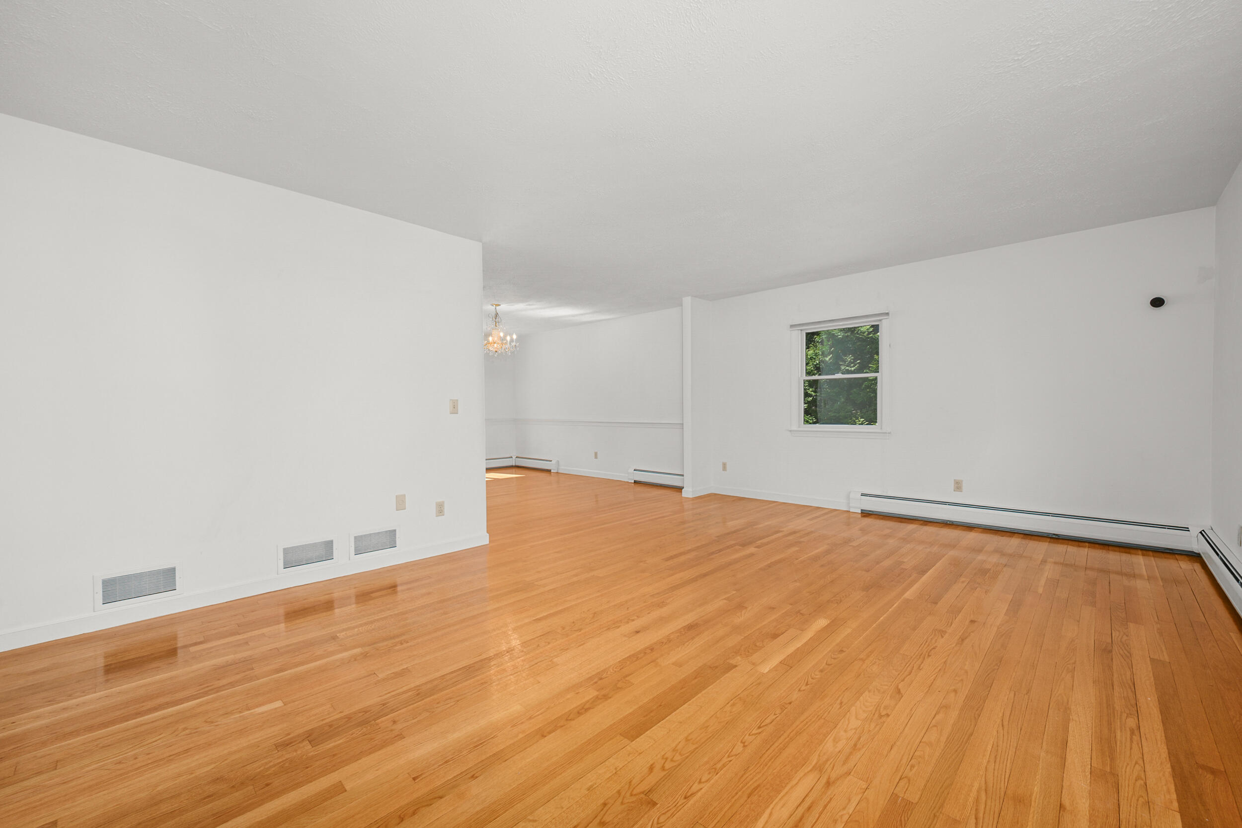 43 Sturgis Lane Barnstable, MA 02630 - Photo 23 of 70 a view of empty room with wooden floor and fan