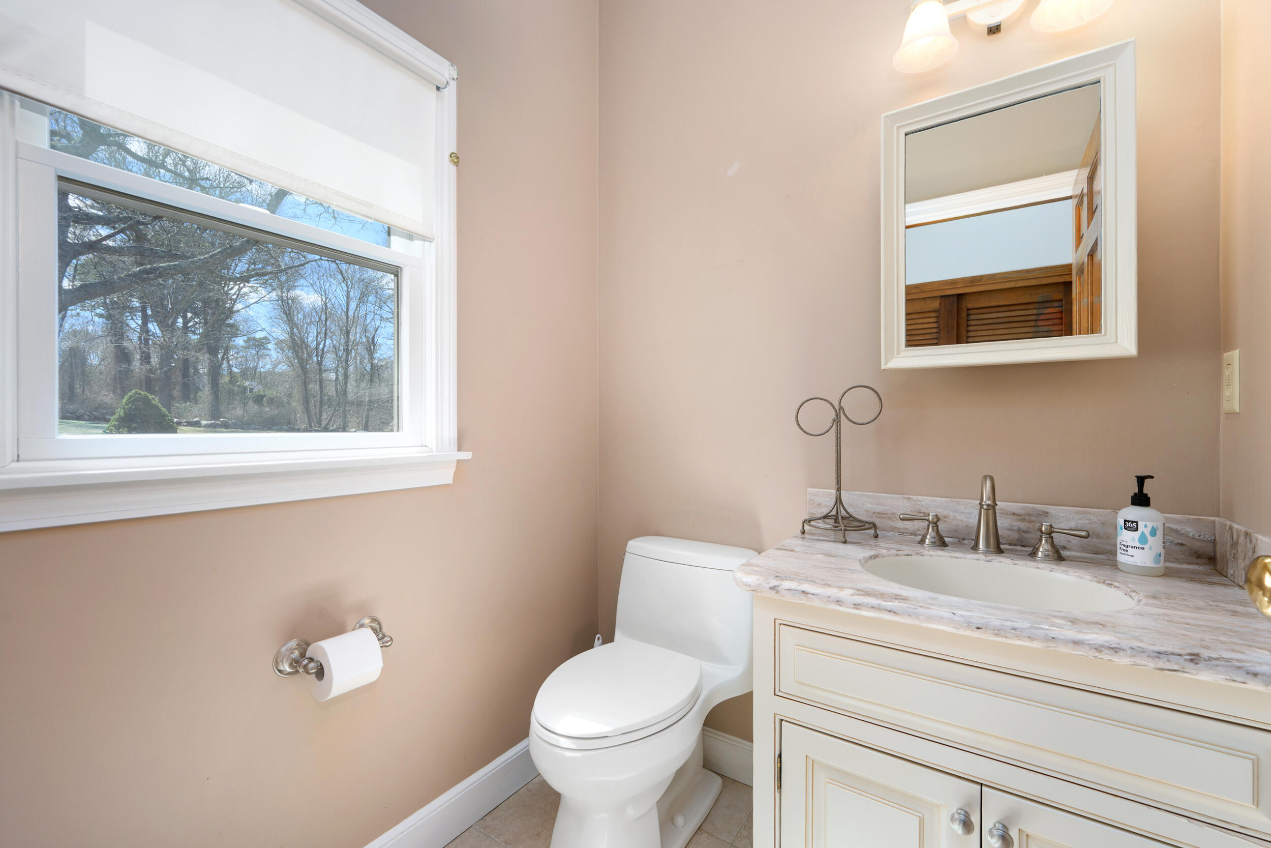 43 Sturgis Lane Barnstable, MA 02630 - Photo 26 of 70 a bathroom with a toilet a sink and mirror