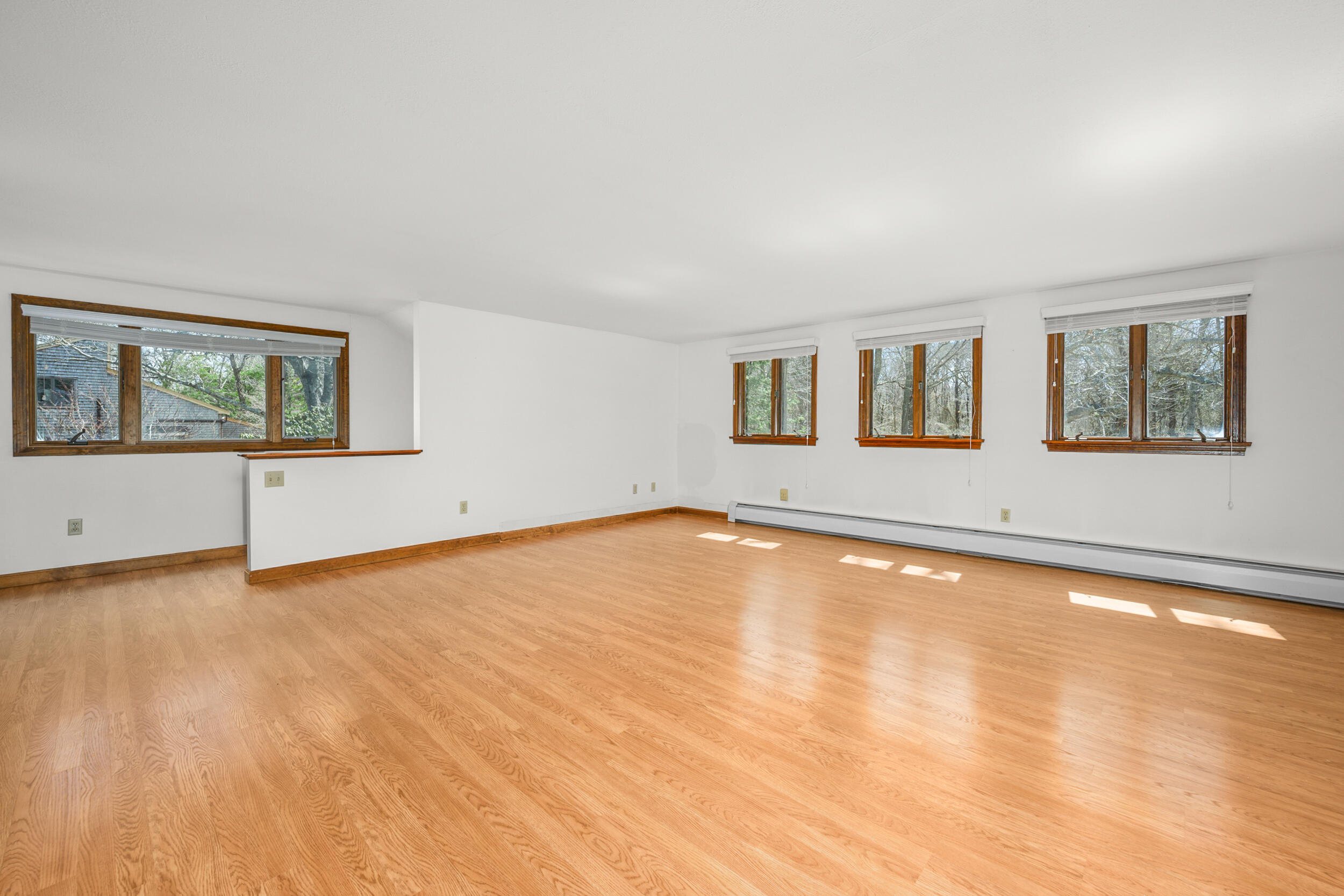 43 Sturgis Lane Barnstable, MA 02630 - Photo 34 of 70 a view of an empty room with a window and wooden floor