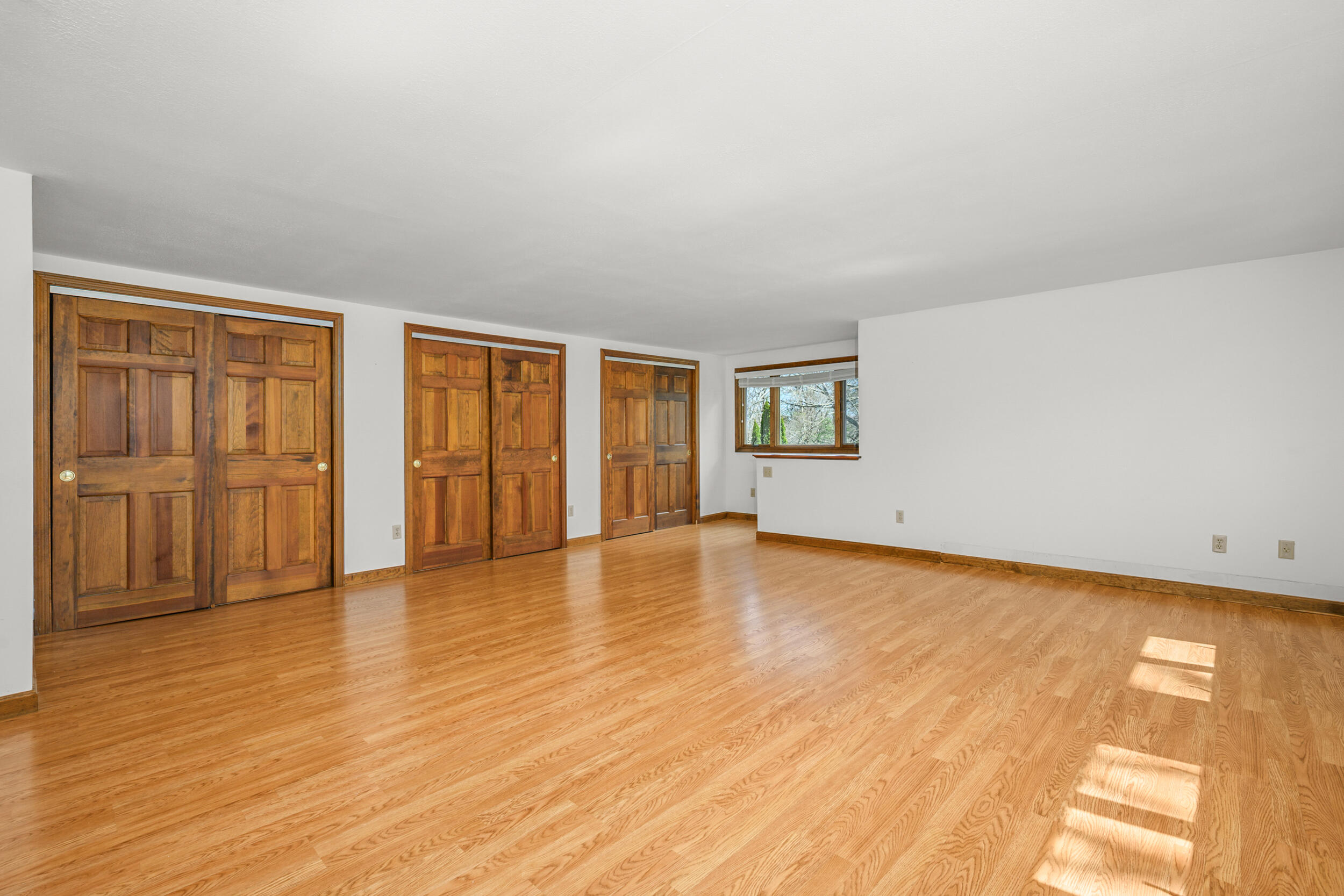 43 Sturgis Lane Barnstable, MA 02630 - Photo 35 of 70 an empty room with wooden floor and windows