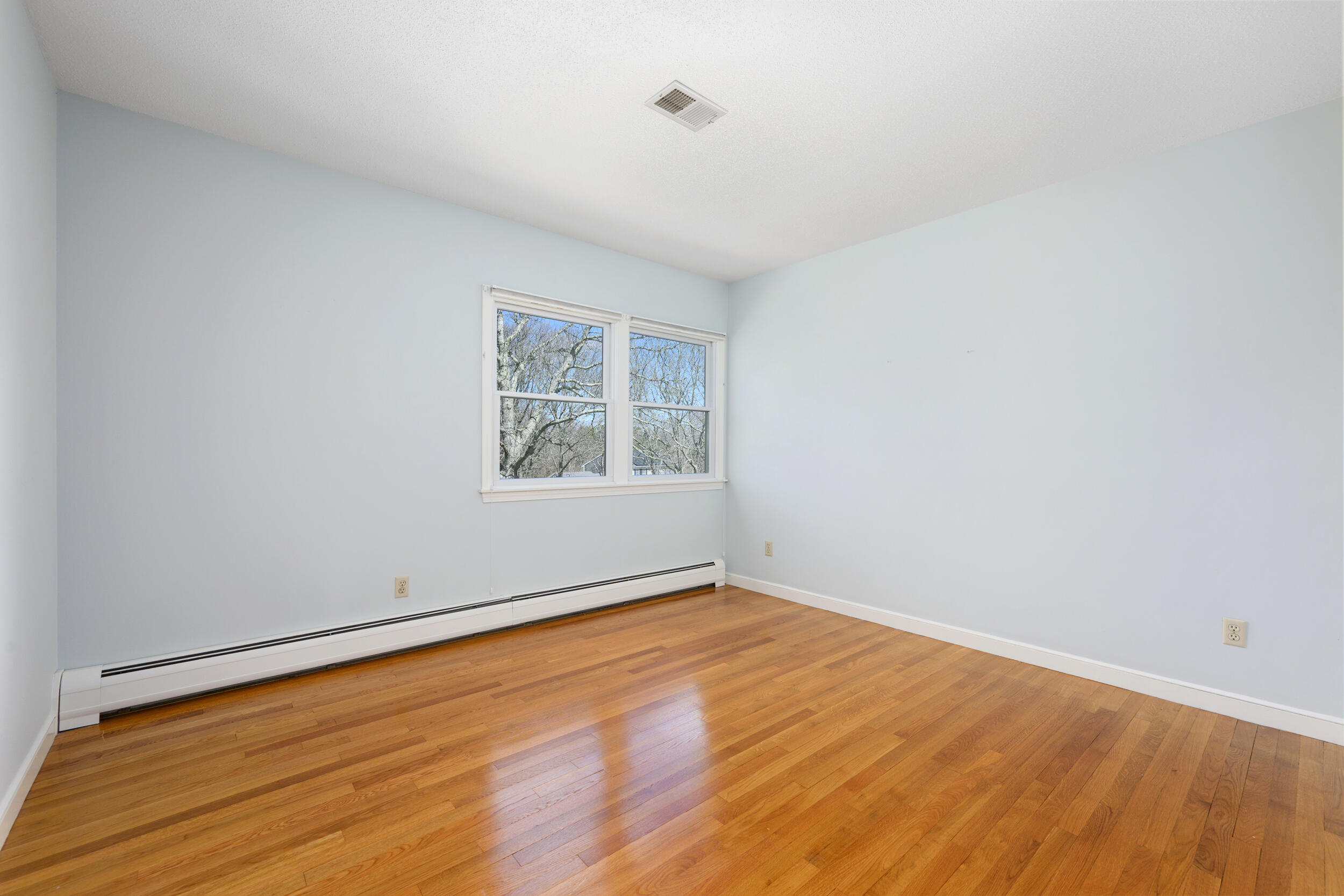 43 Sturgis Lane Barnstable, MA 02630 - Photo 39 of 70 an empty room with wooden floor and windows