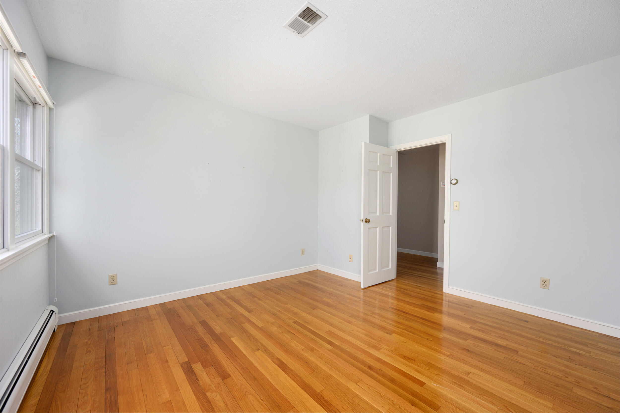 43 Sturgis Lane Barnstable, MA 02630 - Photo 40 of 70 a view of empty room with wooden floor and fan