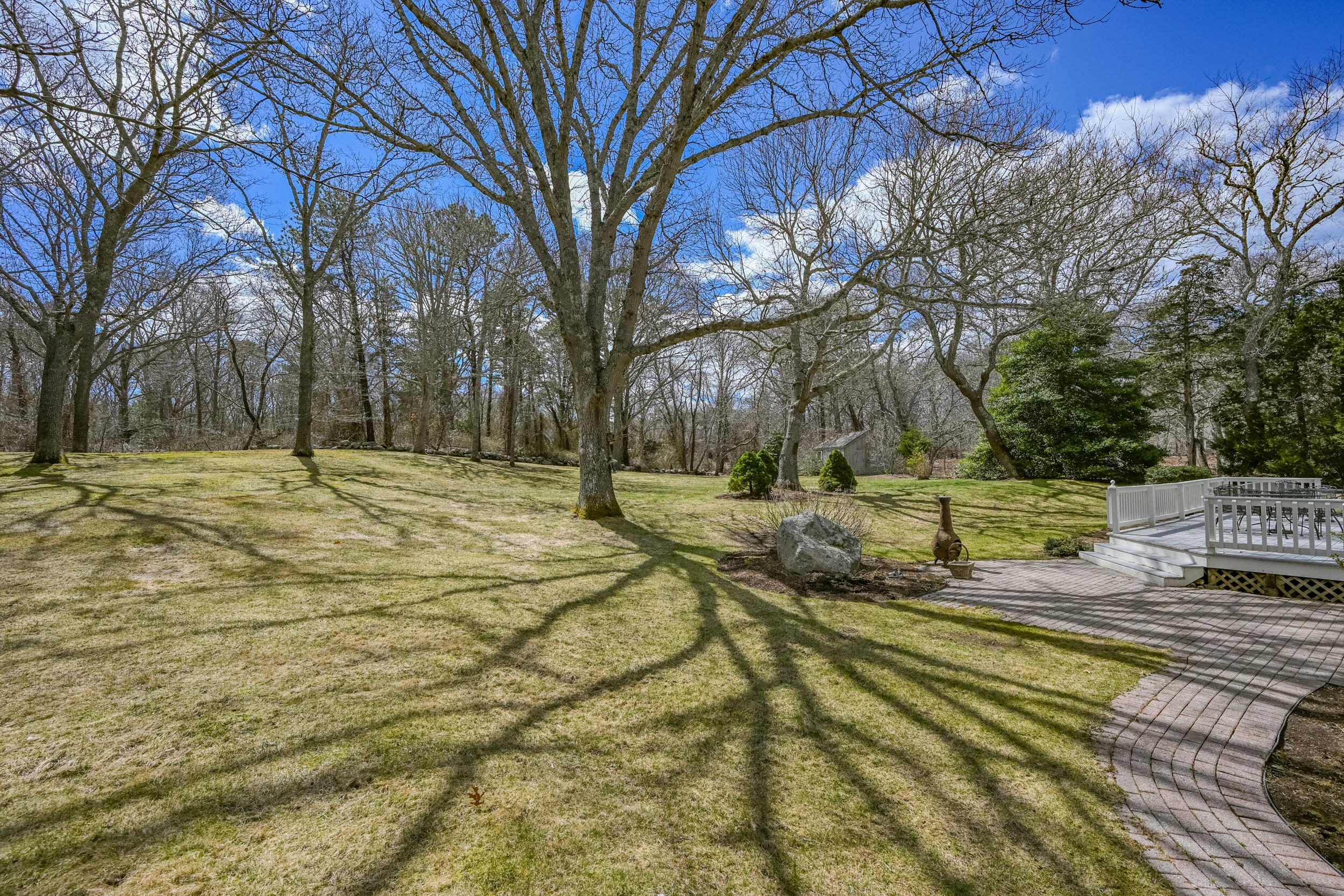 43 Sturgis Lane Barnstable, MA 02630 - Photo 4 of 70 a yard with trees in the background