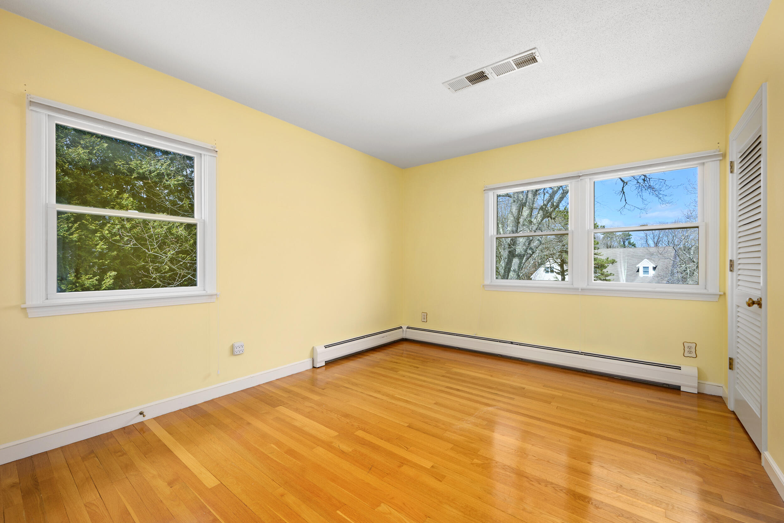 43 Sturgis Lane Barnstable, MA 02630 - Photo 41 of 70 a view of an empty room with a window and wooden floor