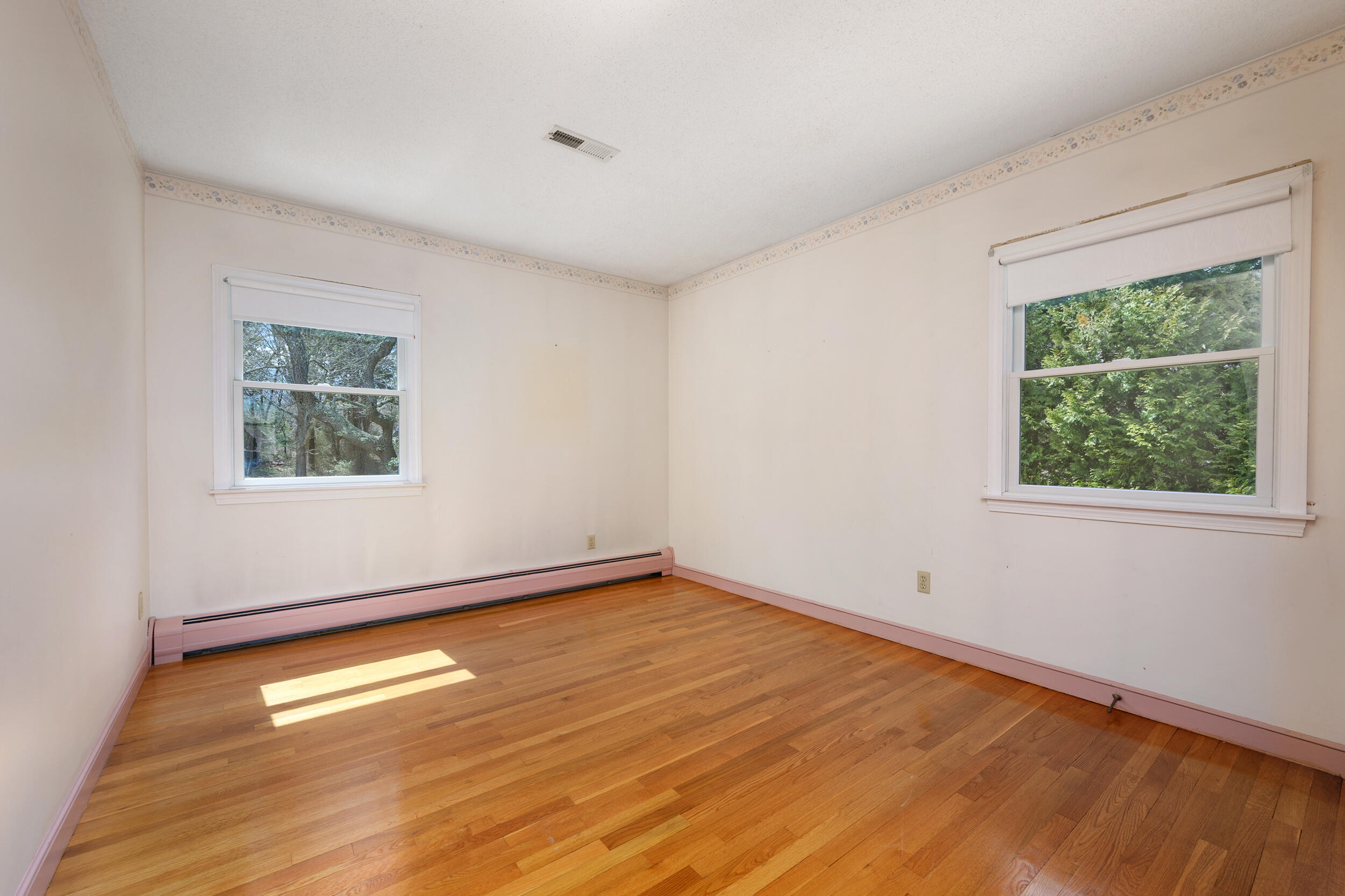 43 Sturgis Lane Barnstable, MA 02630 - Photo 42 of 70 a view of empty room with window and wooden floor