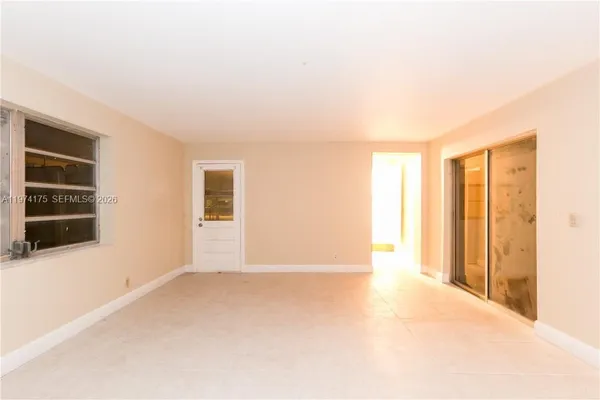 an empty room with a empty space and window
