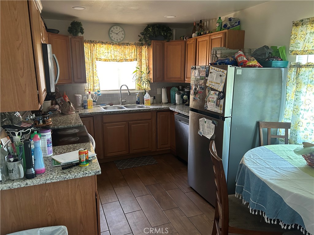 1065 Vine Street Atwater, CA 95301 - Photo 2 of 4 a kitchen with refrigerator and window