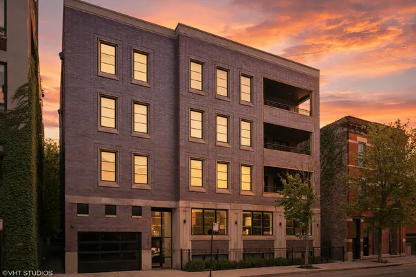 a front view of a building with lot of windows