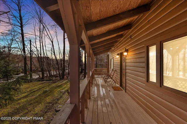 a view of outdoor space with wooden floor