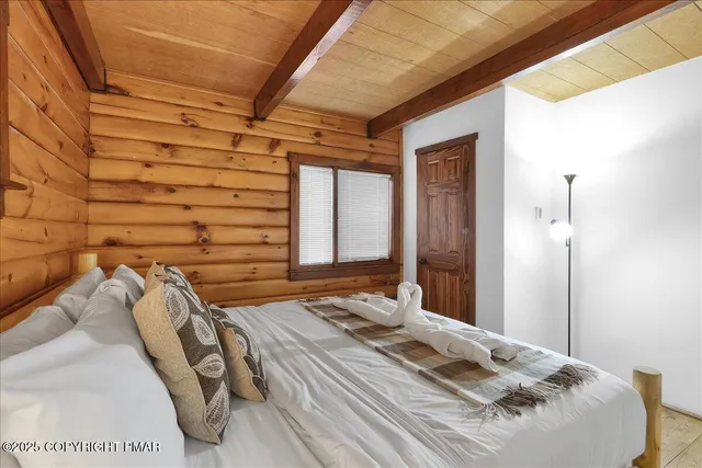a bathroom with a granite countertop sink and washing machine